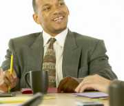 Office Manager consulting with bookkeeper.